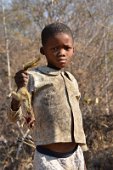 4: Khoisan boy showing a squirrel hunted
